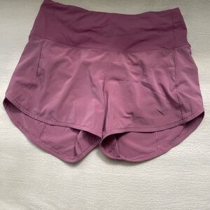 Velvet dust Lululemon 4” high rise lined shorts.